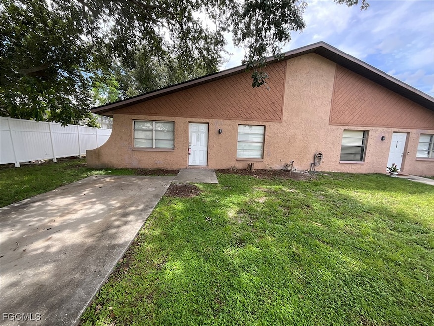 Ranch-style house featuring stucco siding