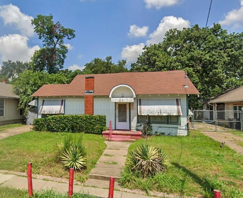 Bungalow-style house with a front lawn