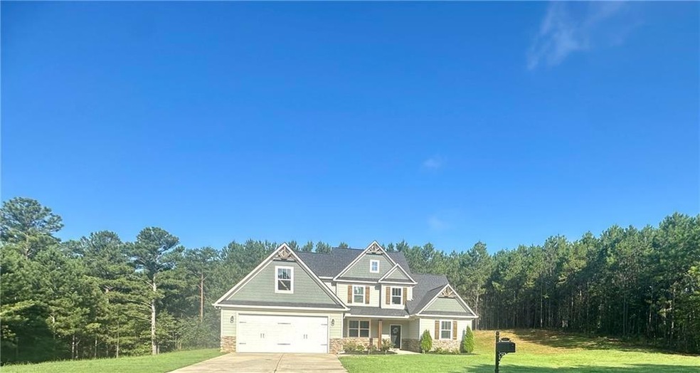 View of front of property with a garage and a fron