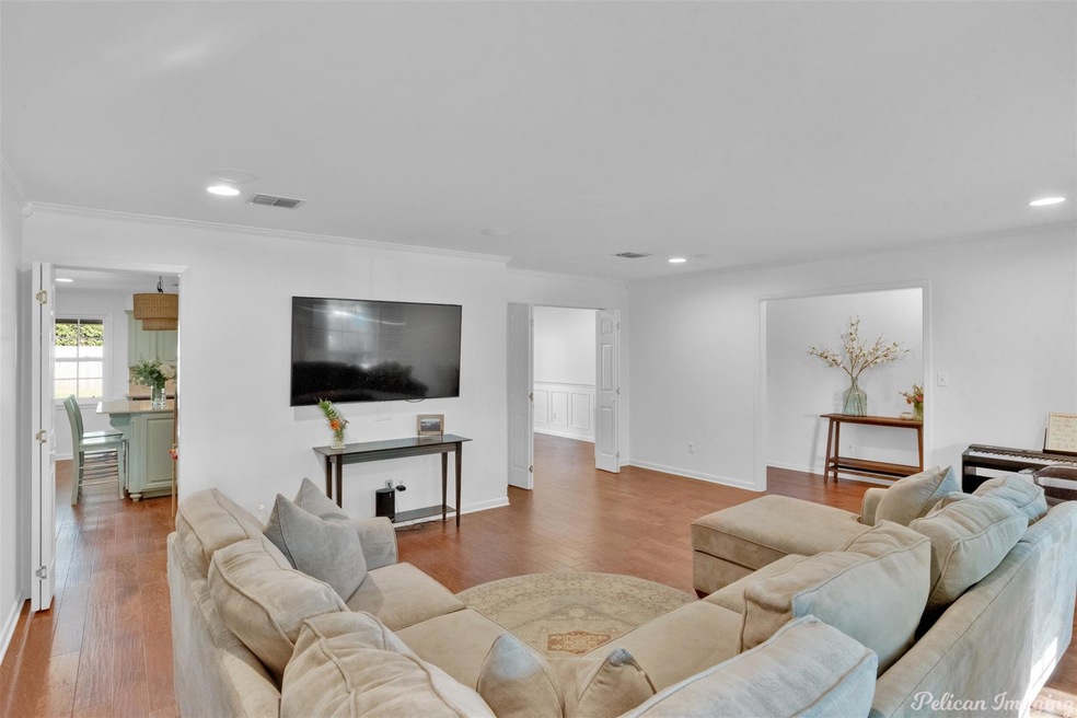 Living room with hardwood / wood-style floors and 