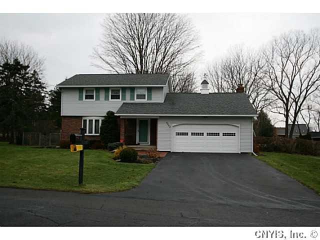 Exterior Front. Newer insulated garage doors and c