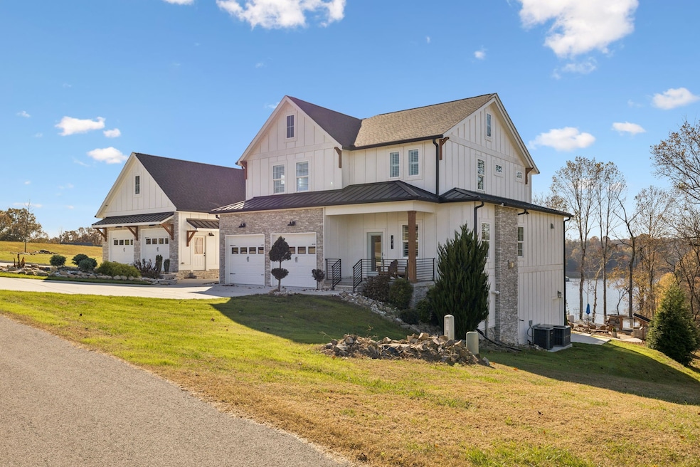 Welcome Home! Stunning modern farmhouse design with coveted lake views and ample garage space.