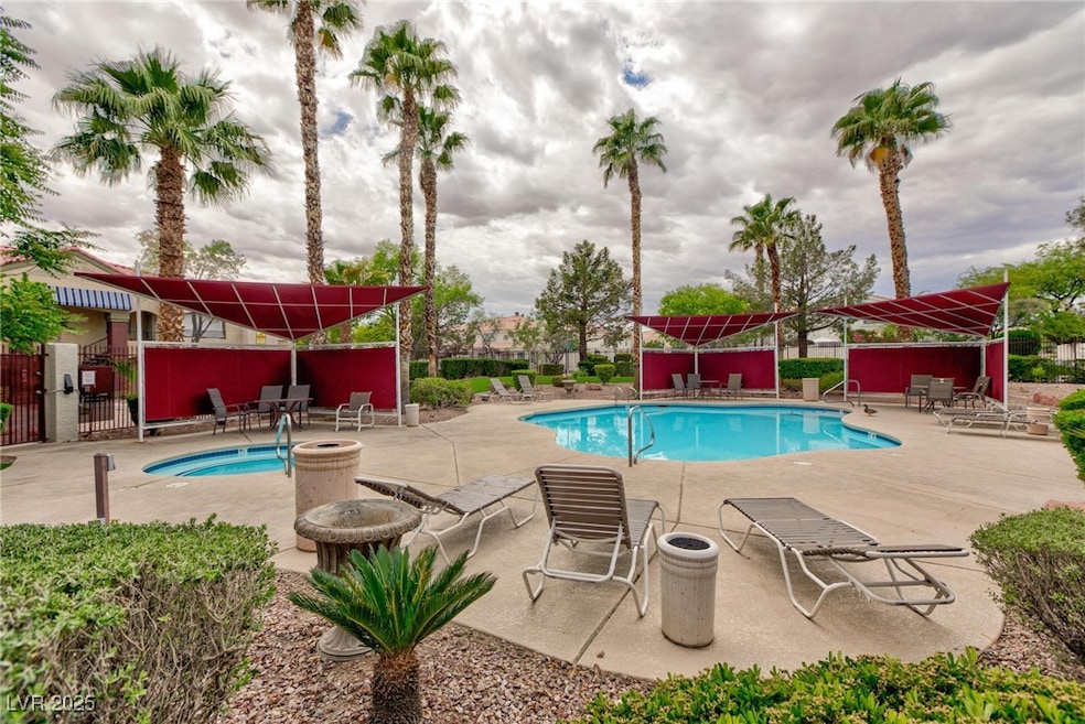 Community pool with a patio area