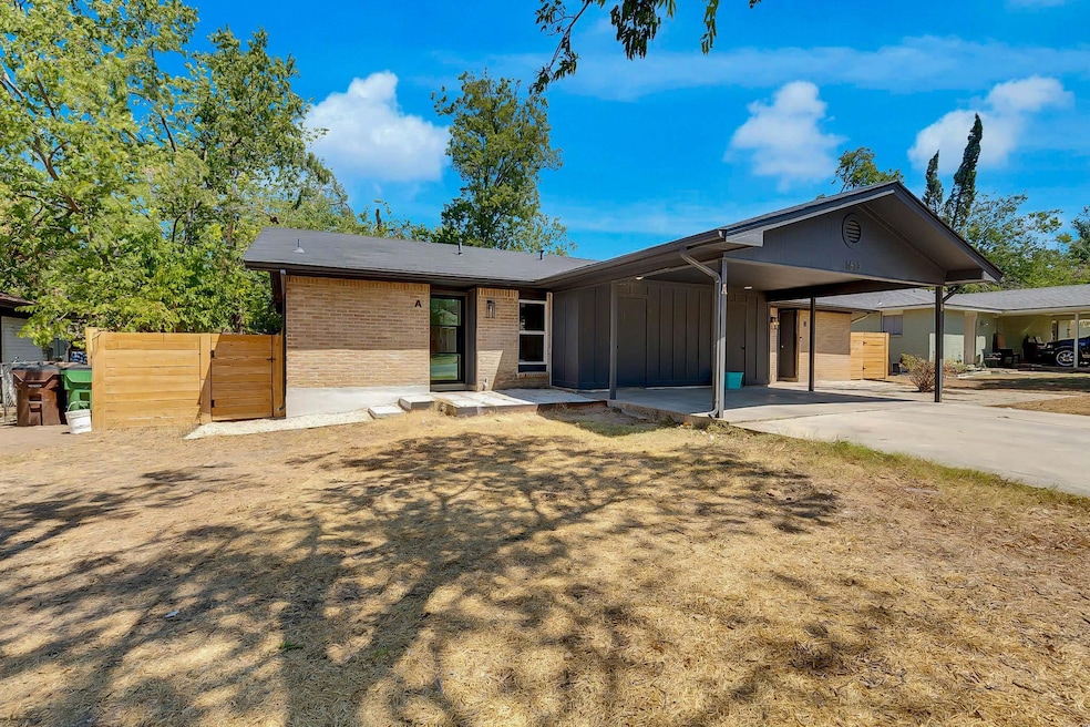 Ranch-style house with a carport, board and batte