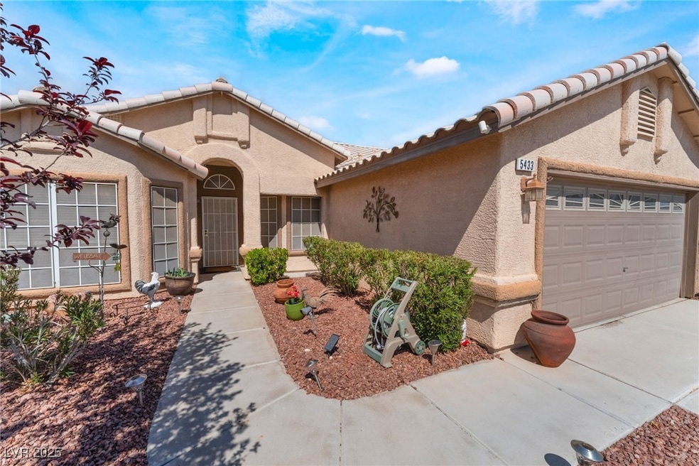 Mediterranean / spanish house with driveway, stucc