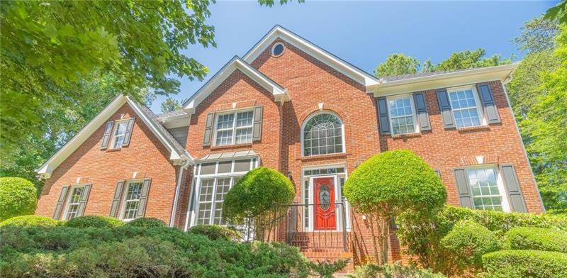 Gorgeous brick home is ideally located in the hear
