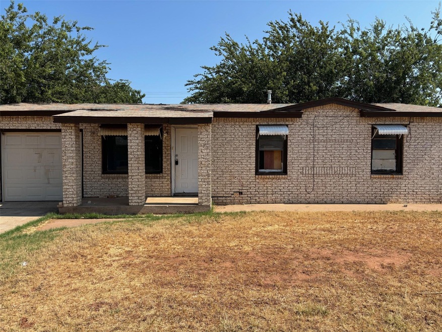 View of front of home featuring a garage and a fro