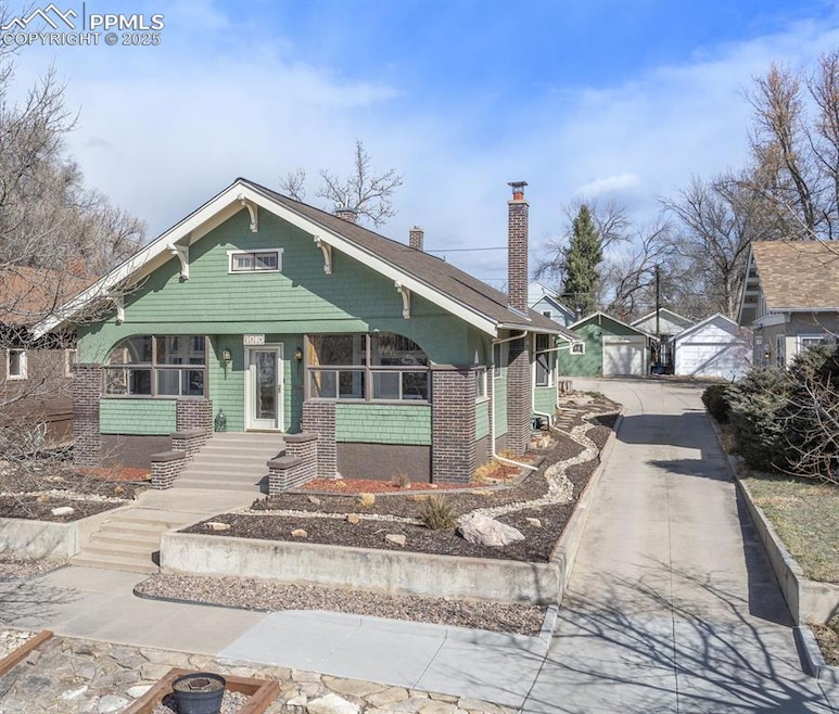 View of front of house with an outdoor structure, 