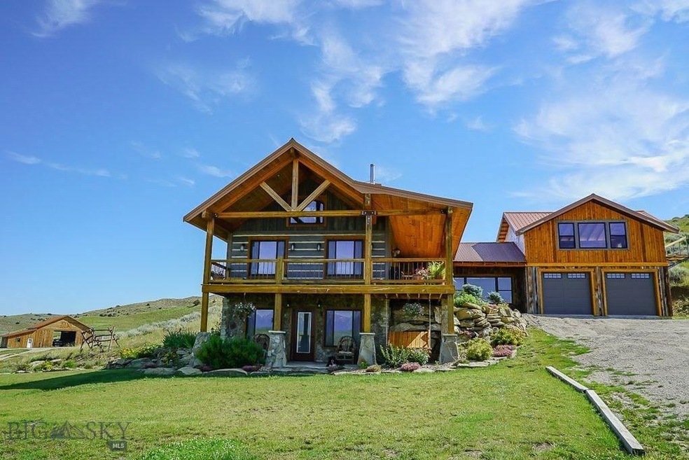 Reclaimed wood and stone exterior.  Andersen windo