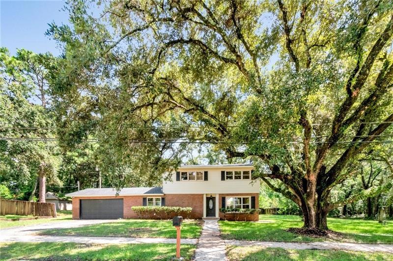 This is an immaculate, updated home on nearly 3/4 