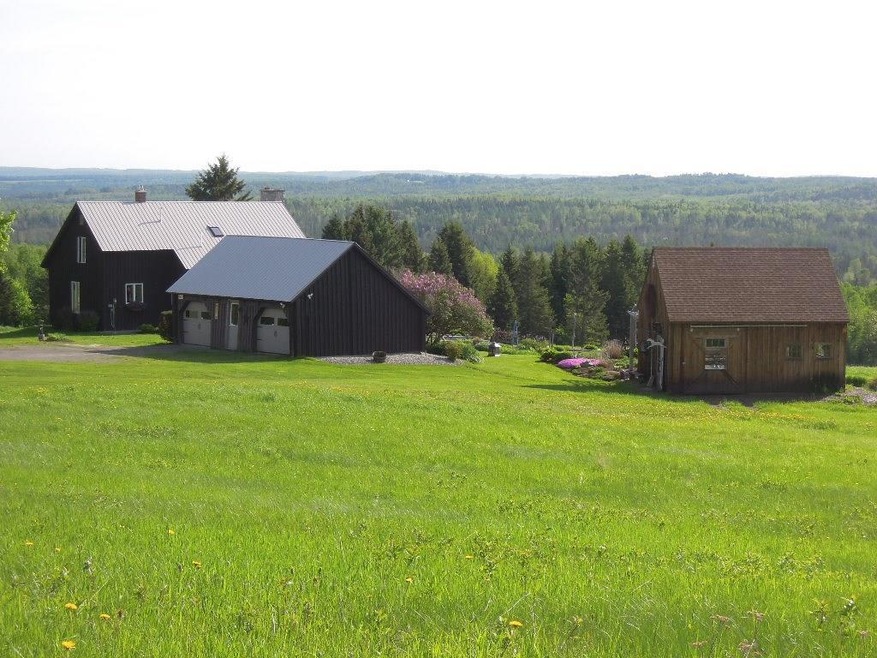 This VIEW! Two car garage, a tractor...