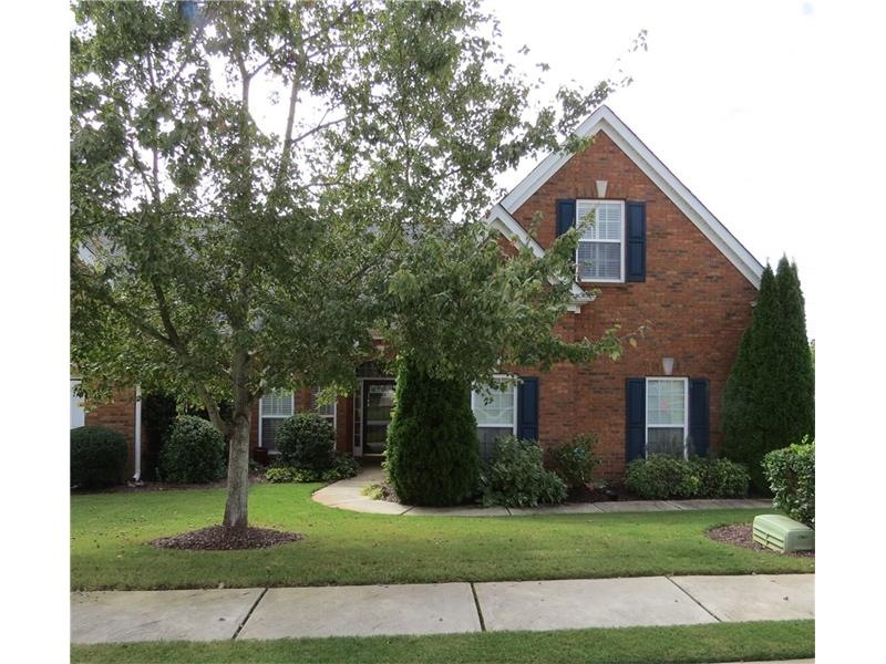 A welcoming walkway to this charming four sided br