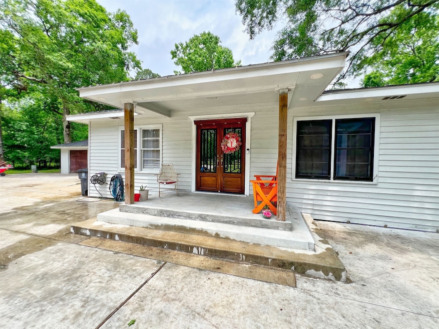 Welcome home! A charming front porch invites you t