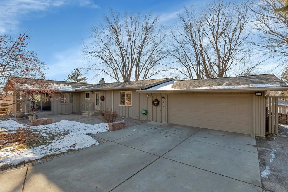Garage, paver stone patio and entry door
