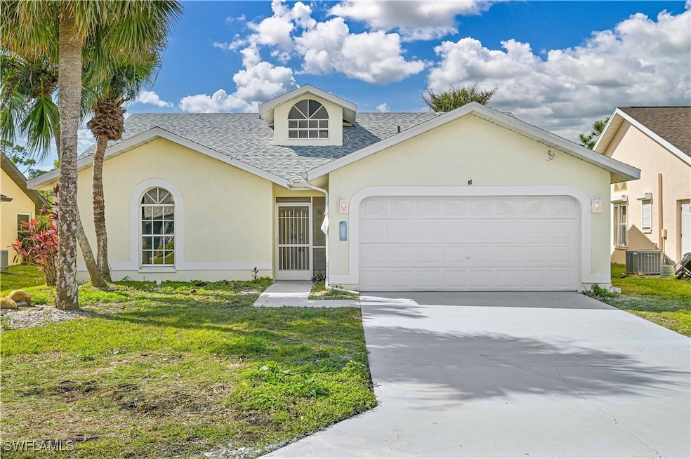 View of front of home with roof with shingles, an