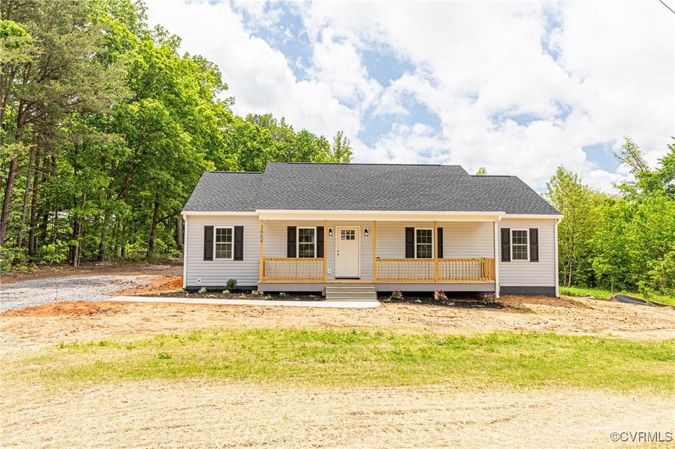 View of front of property with covered porch and r