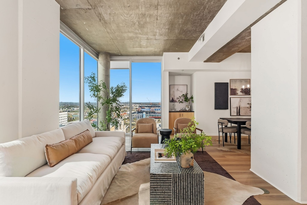 Spacious living room with downtown and Nissan Stadium views