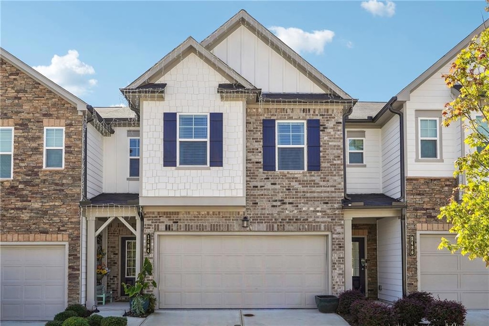 Multi unit property featuring brick siding, board 