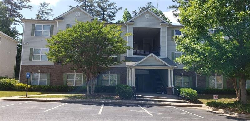 Second floor unit facing parking lot.