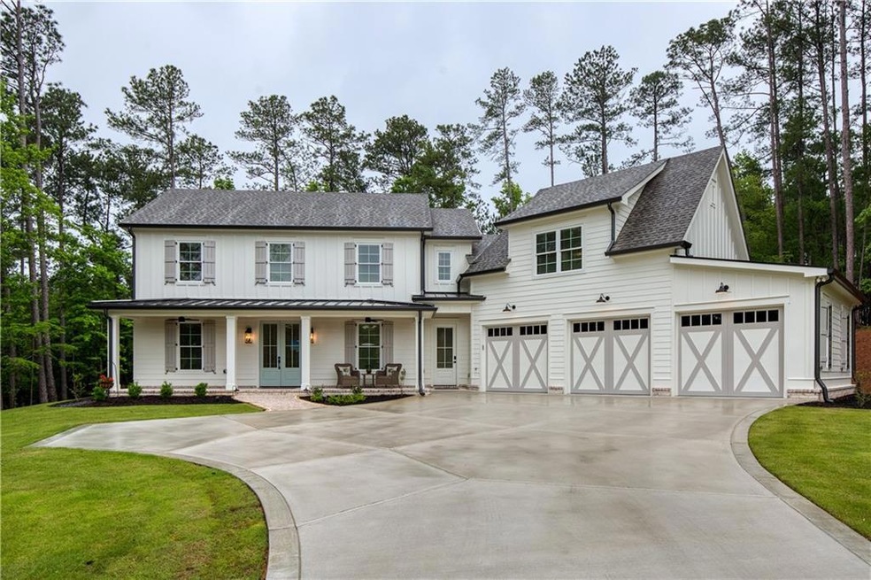 Modern farmhouse style home with driveway, roof wi