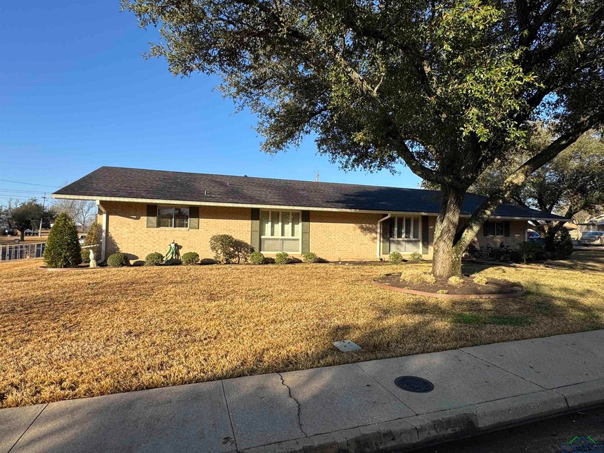 Ranch-style home with a front yard