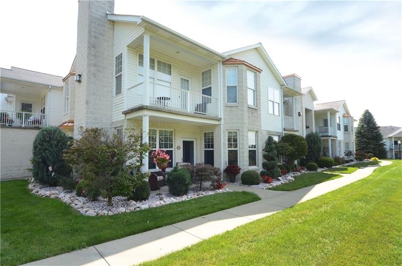 Lovely first floor end unit, nicely landscaped