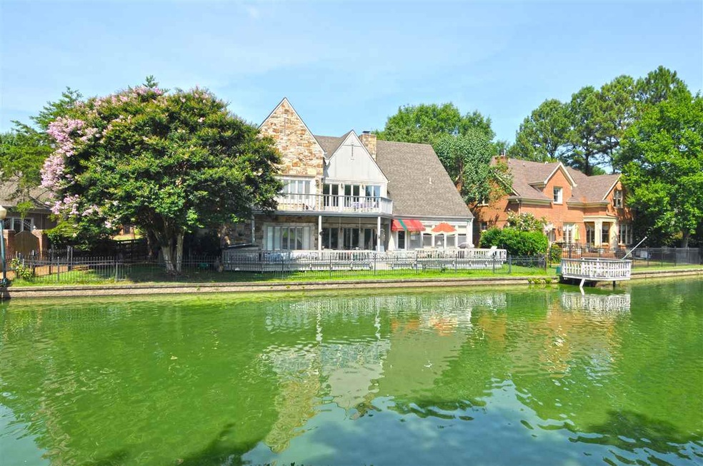 The back of this home backs up to a beautiful lake