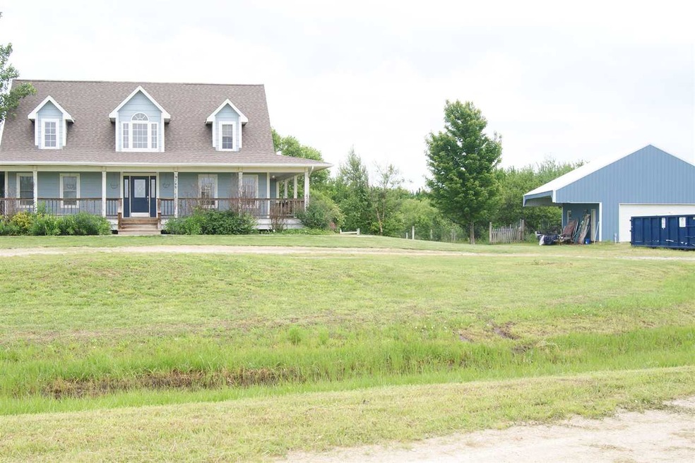 Great 1.5 Story home with wrap around porch and la