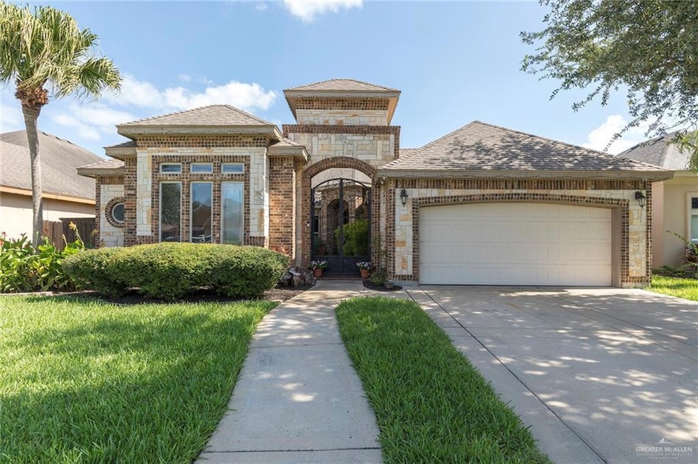 Lovely Dolcan home featuring brick & stone siding with gated courtyard entrance