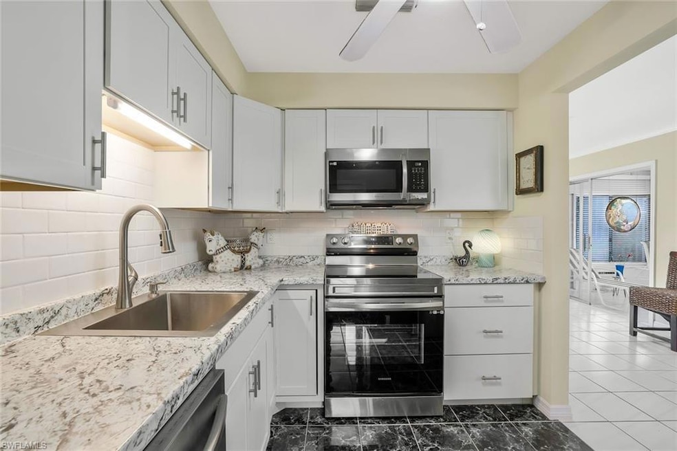 Kitchen featuring sink, stainless steel appliances