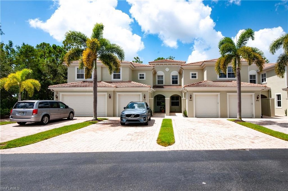 Front of Condo with extra long driveway