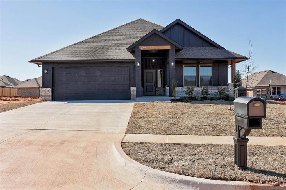 View of front facade featuring a garage