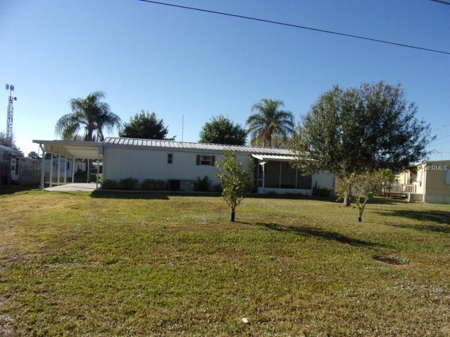 FRONT WITH CARPORT