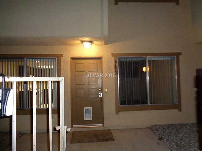 Property Photo. Enclosed front courtyard with wrou