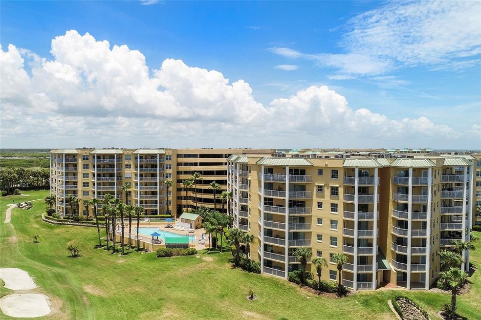Balconies for the unit overlooks the pool and golf
