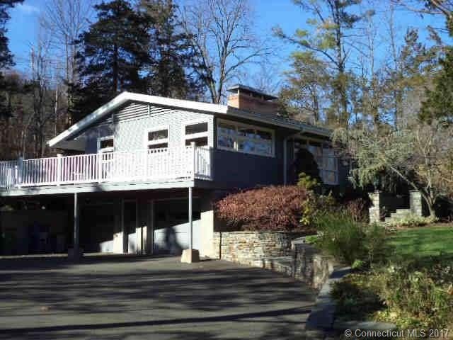 View of side deck of house with stone walkway to t