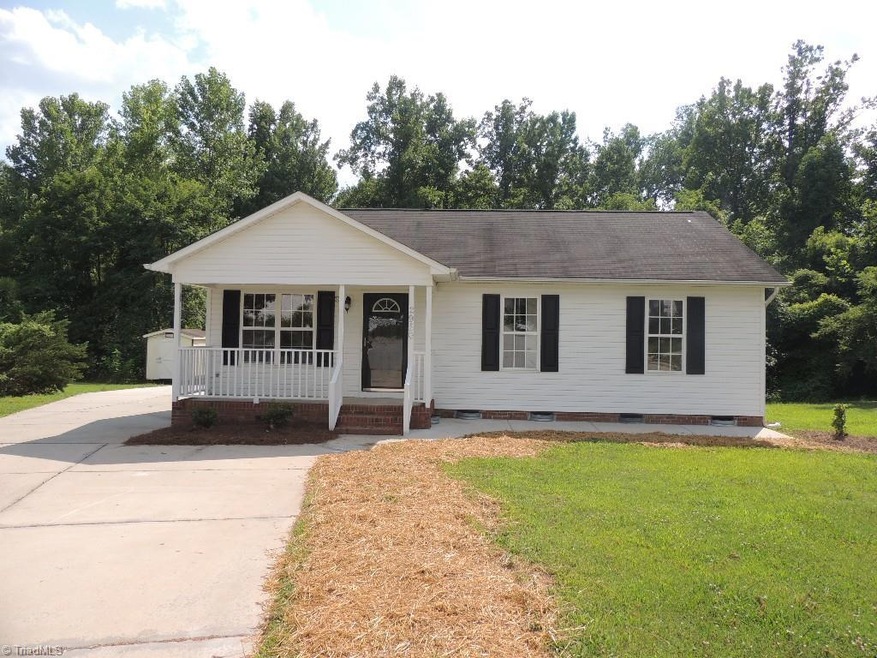 Welcoming front porch and large parking area