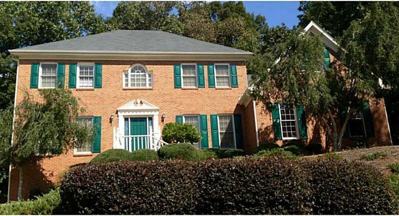 Exterior Front. Majestic Brick Home in Moorings!!