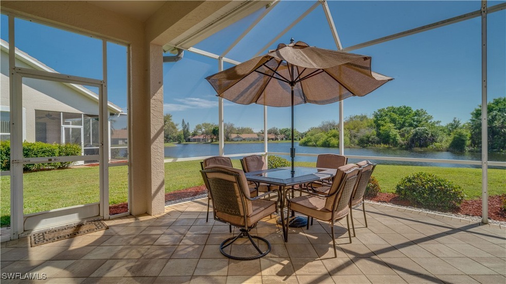 Sunroom featuring a water view and outdoor dining