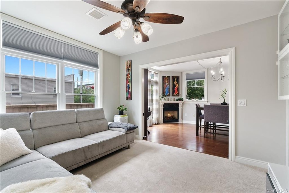 Sleek living room leading to dining area