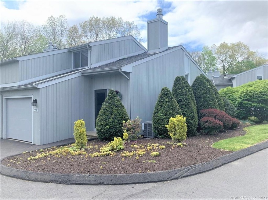 End unit with mature landscaping and attached 1-ca