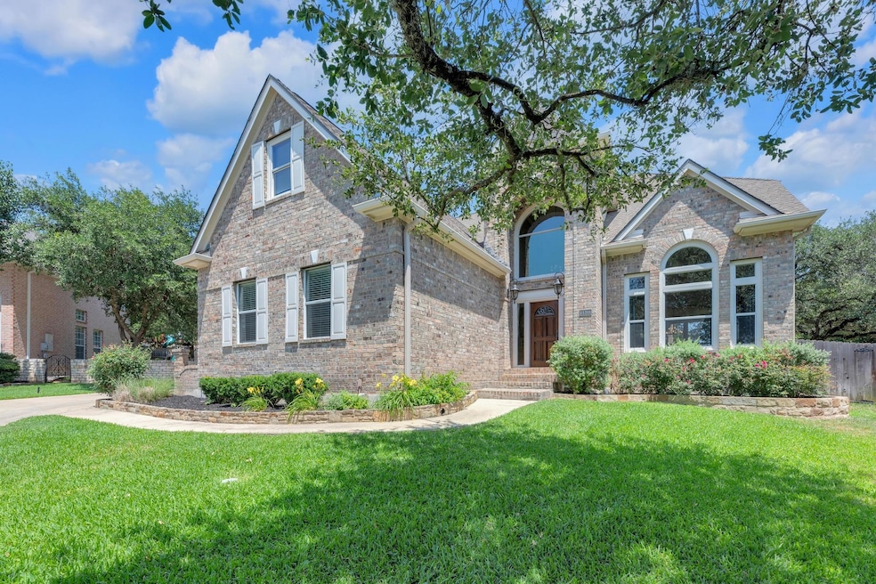 Traditional-style house with brick siding