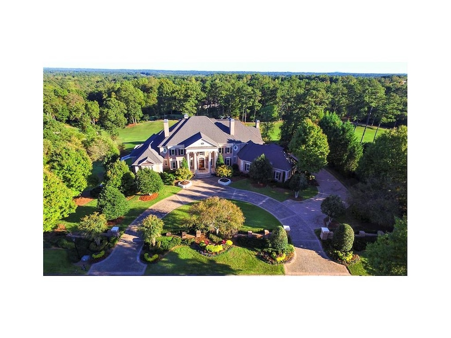 Exquisite, 1.3-Acre Estate positioned along the 18
