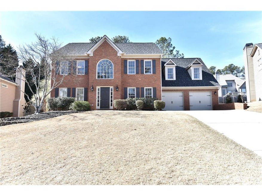 Traditional Brick with updated carriage garage doo