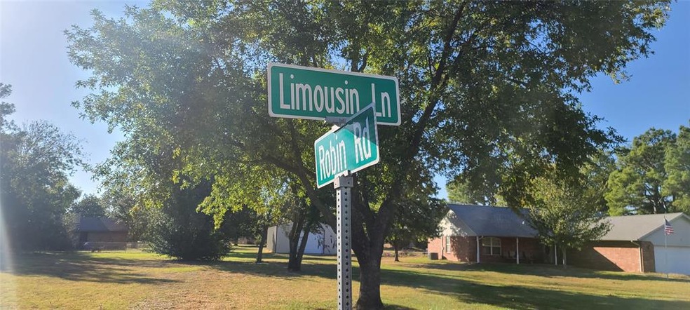 Community / neighborhood sign with a yard