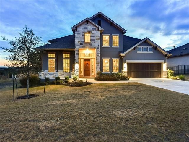 Stunning Street Appeal with Texas Mix Limestone, Stucco, & Cedar Garage Door w/Keypad