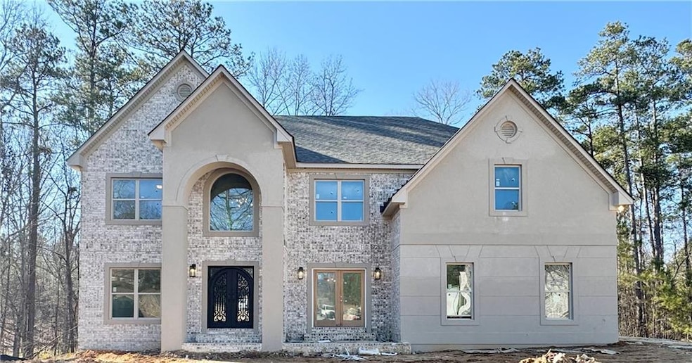 View of front facade with brick siding, french doo