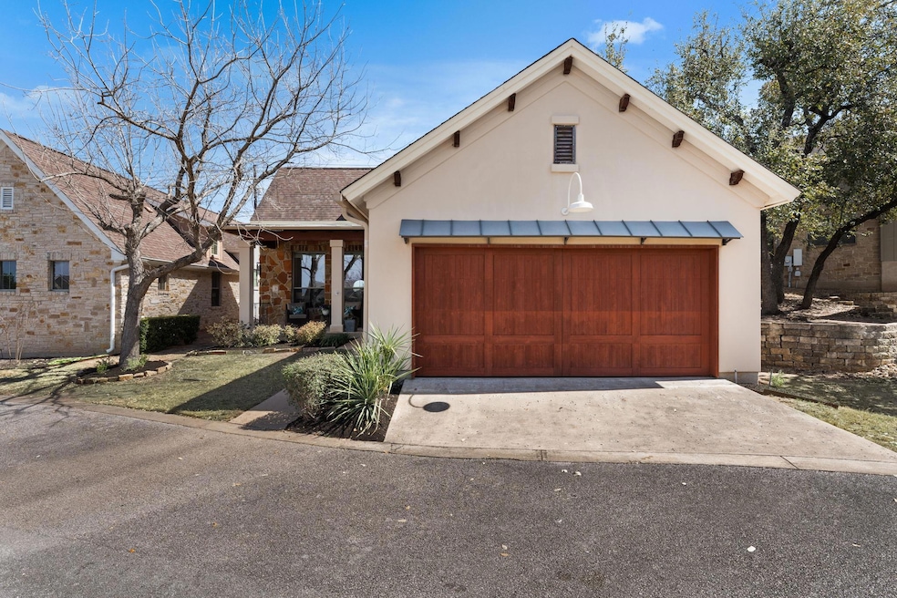 View of front of house with stucco siding, an att