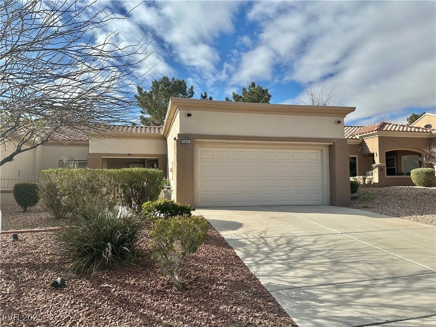 View of front of home with stucco siding, concrete