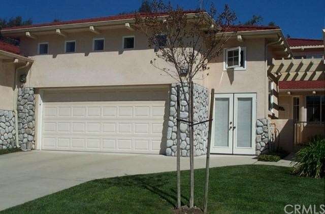 FRONT VIEW OF THE RESIDENCE INCLUDING THE GOLF CAR